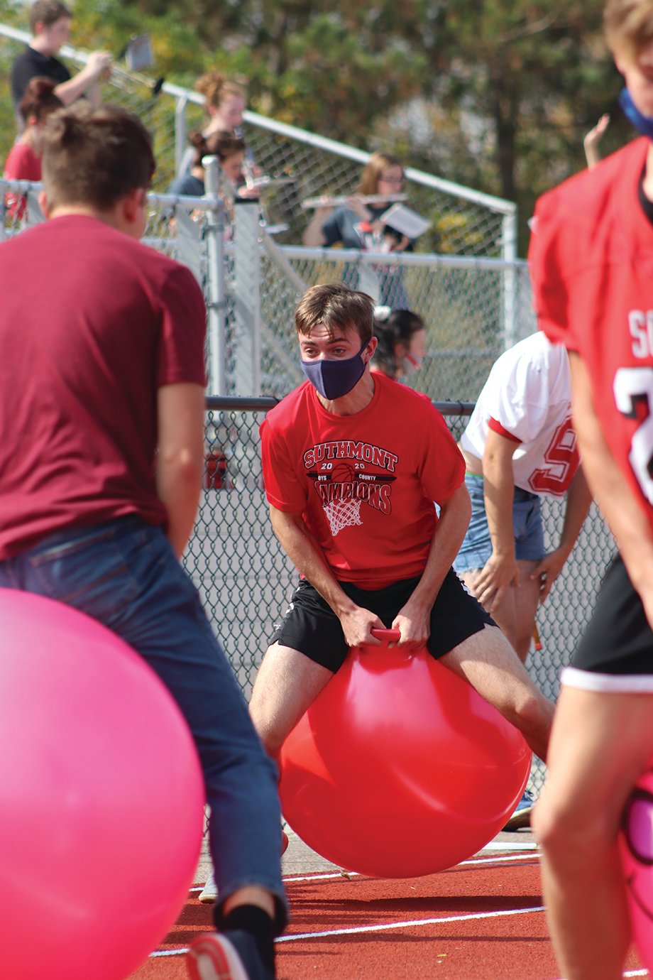 Participants of the hippity hop relay race make their way down and back on Southmont's track Friday.